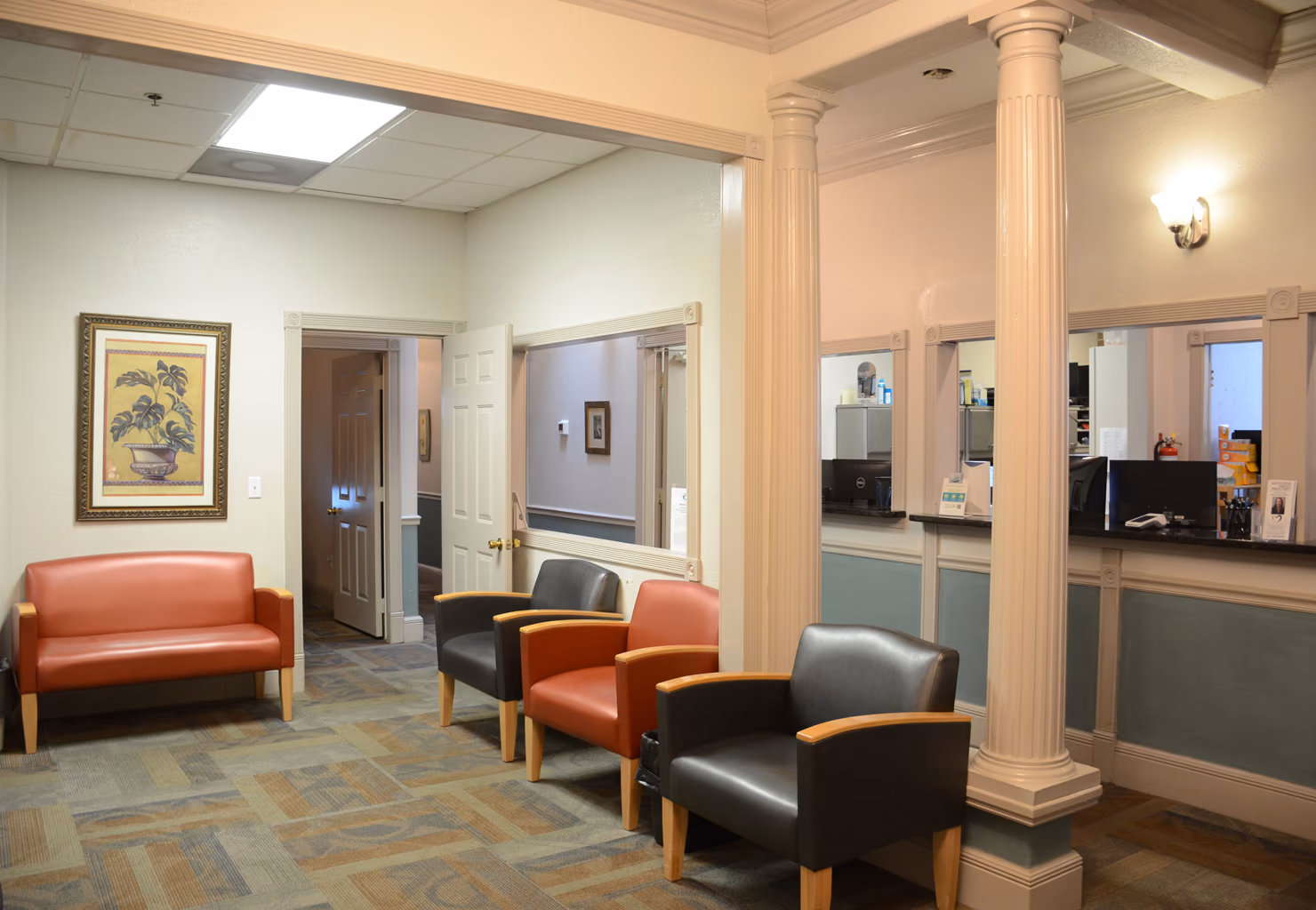 The upstairs waiting room at Aker Eye Downtown, with the check-in window on the right
