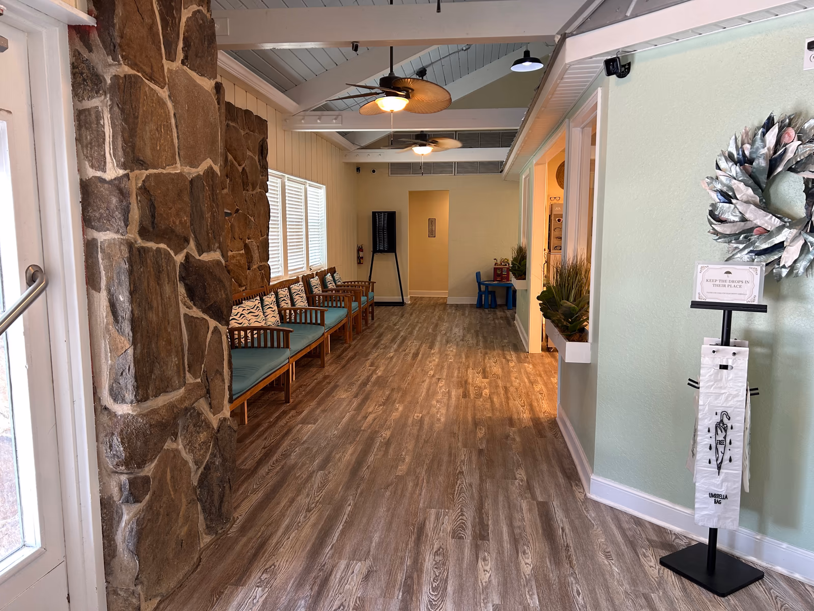 Just inside the front door at Aker Eye Playalinda, looking down the waiting room toward the exam rooms